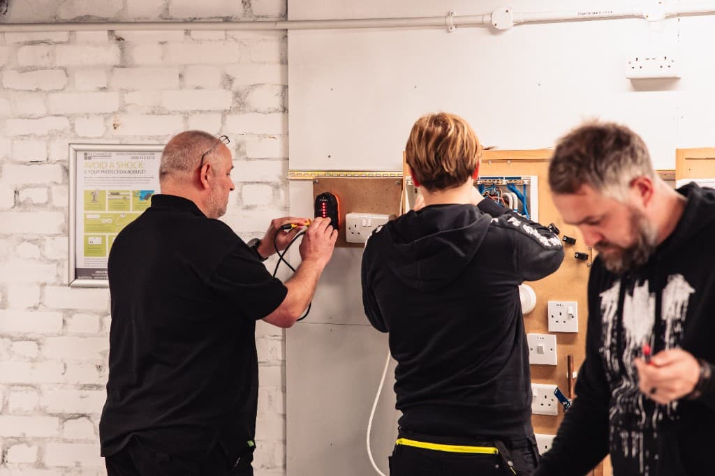 Technicians in an electrical training workshop